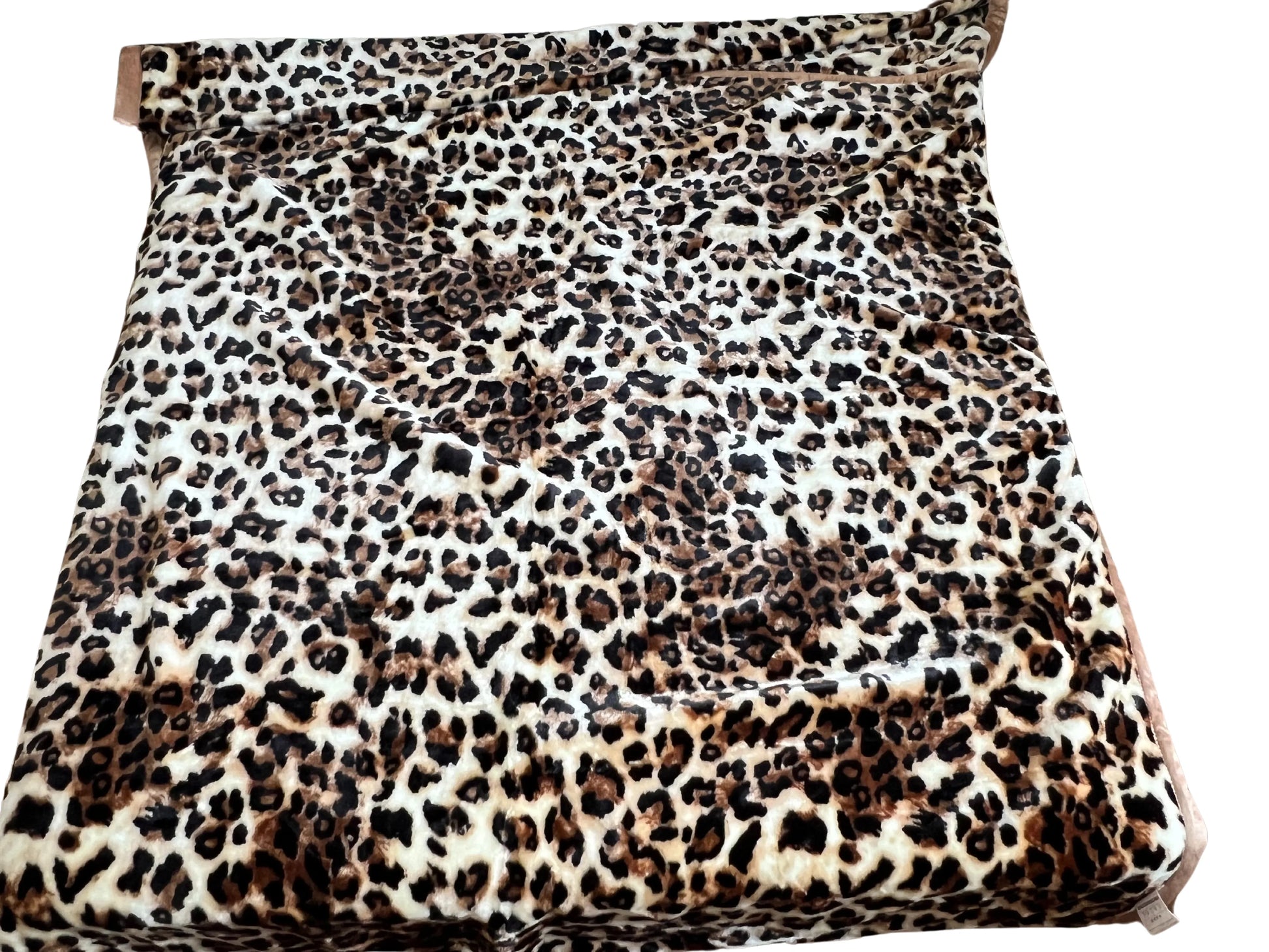 SilkenWarmth Raschel blanket, leopard print, draped with textured folds