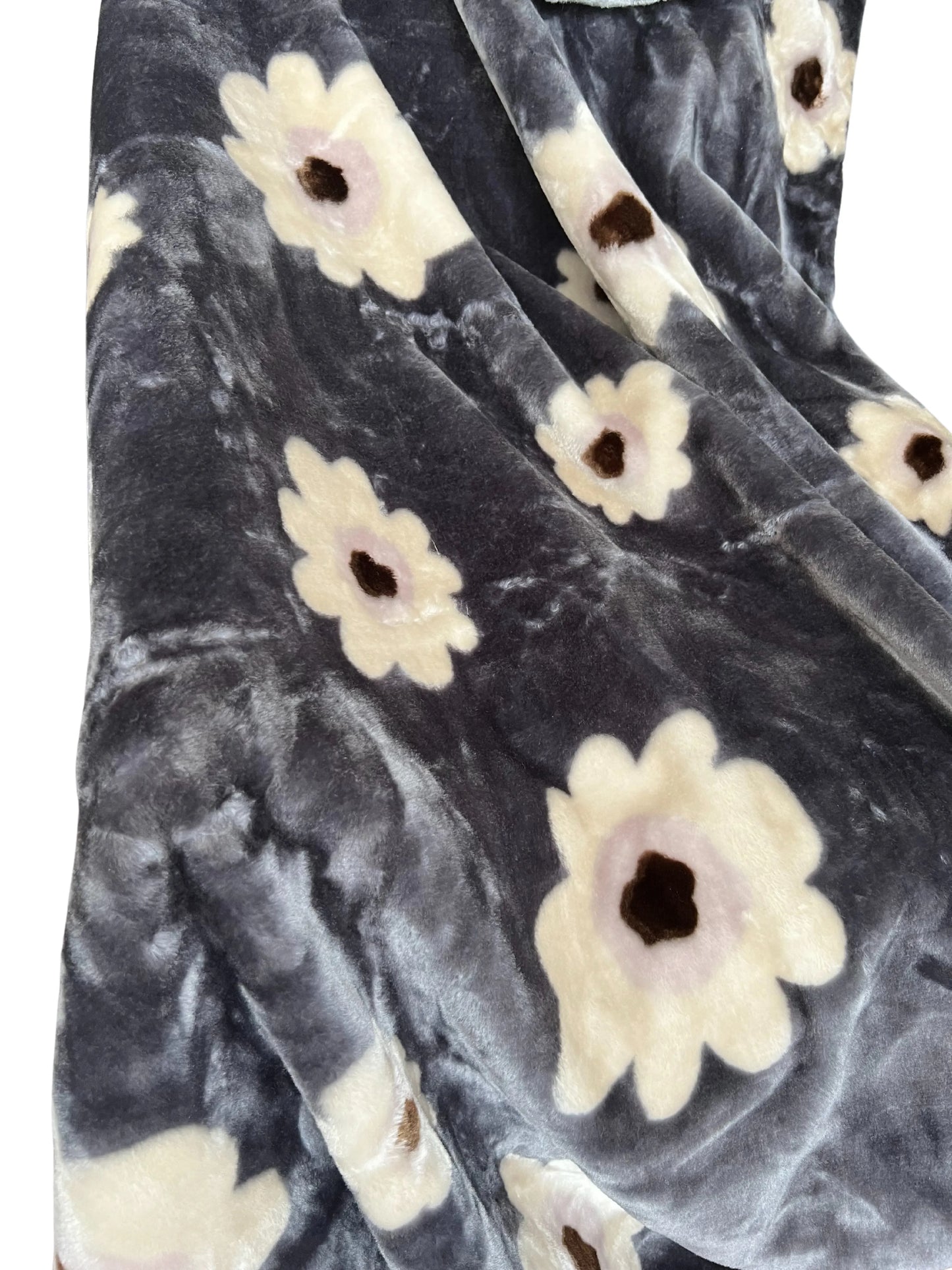 Cozy plush blanket with large flowers; dark gray and white panels, mustard‑yellow blooms, and a silky quilted edge.